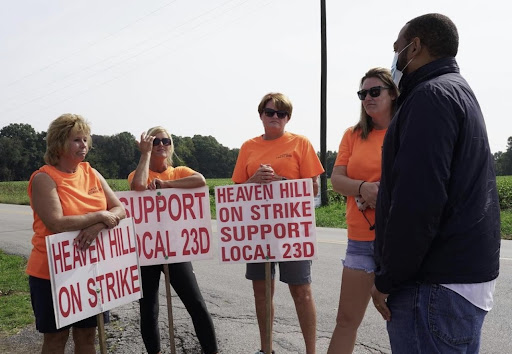 Senate candidate Charles Booker with Heaven Hill workers on strike